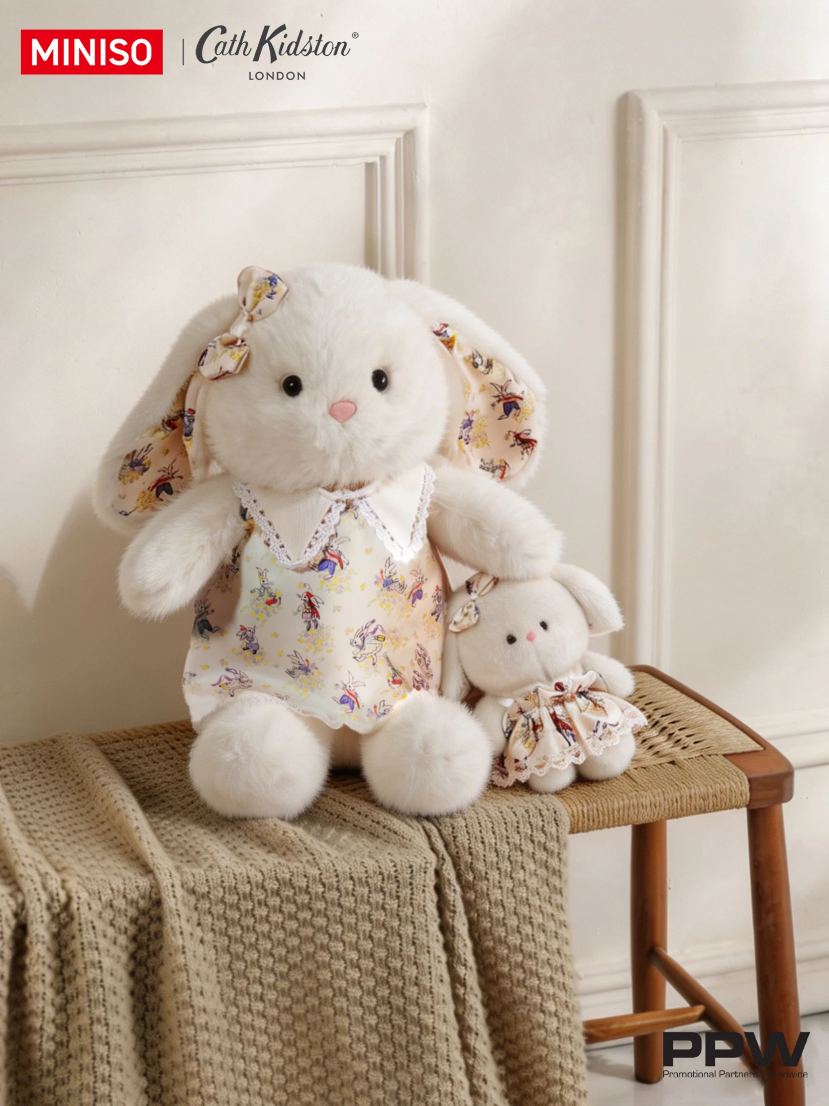 Two Cath Kidston rabbit plush toys in patterned dresses