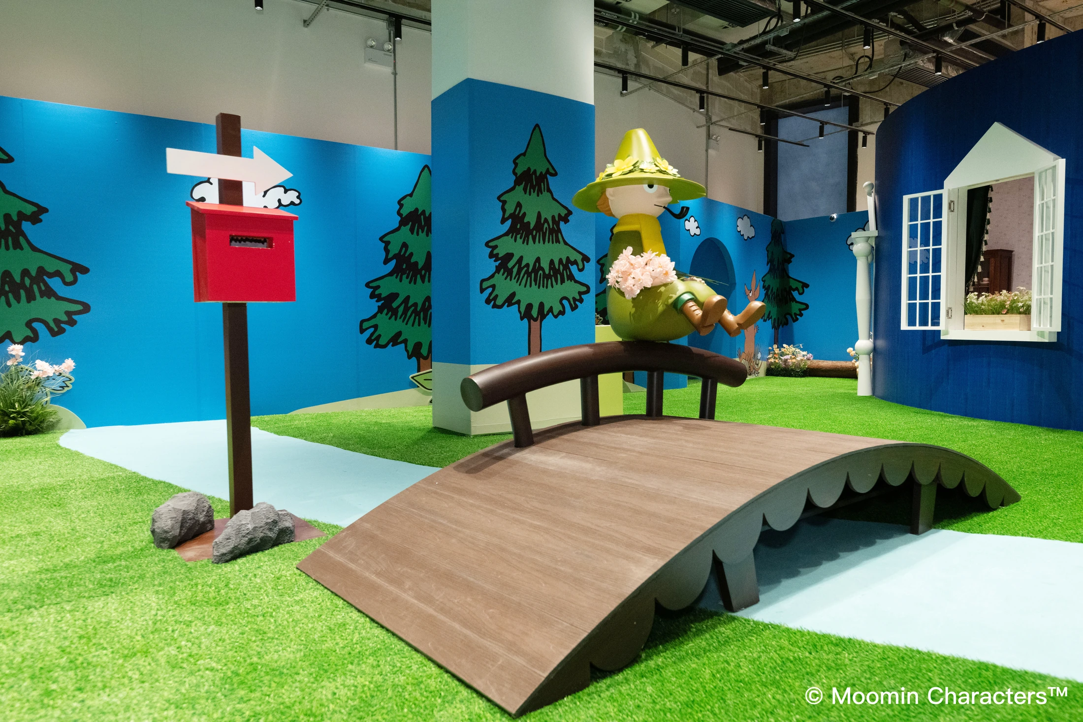 A Snufkin bridge and Moominhouse environment in the anniversary exhibition