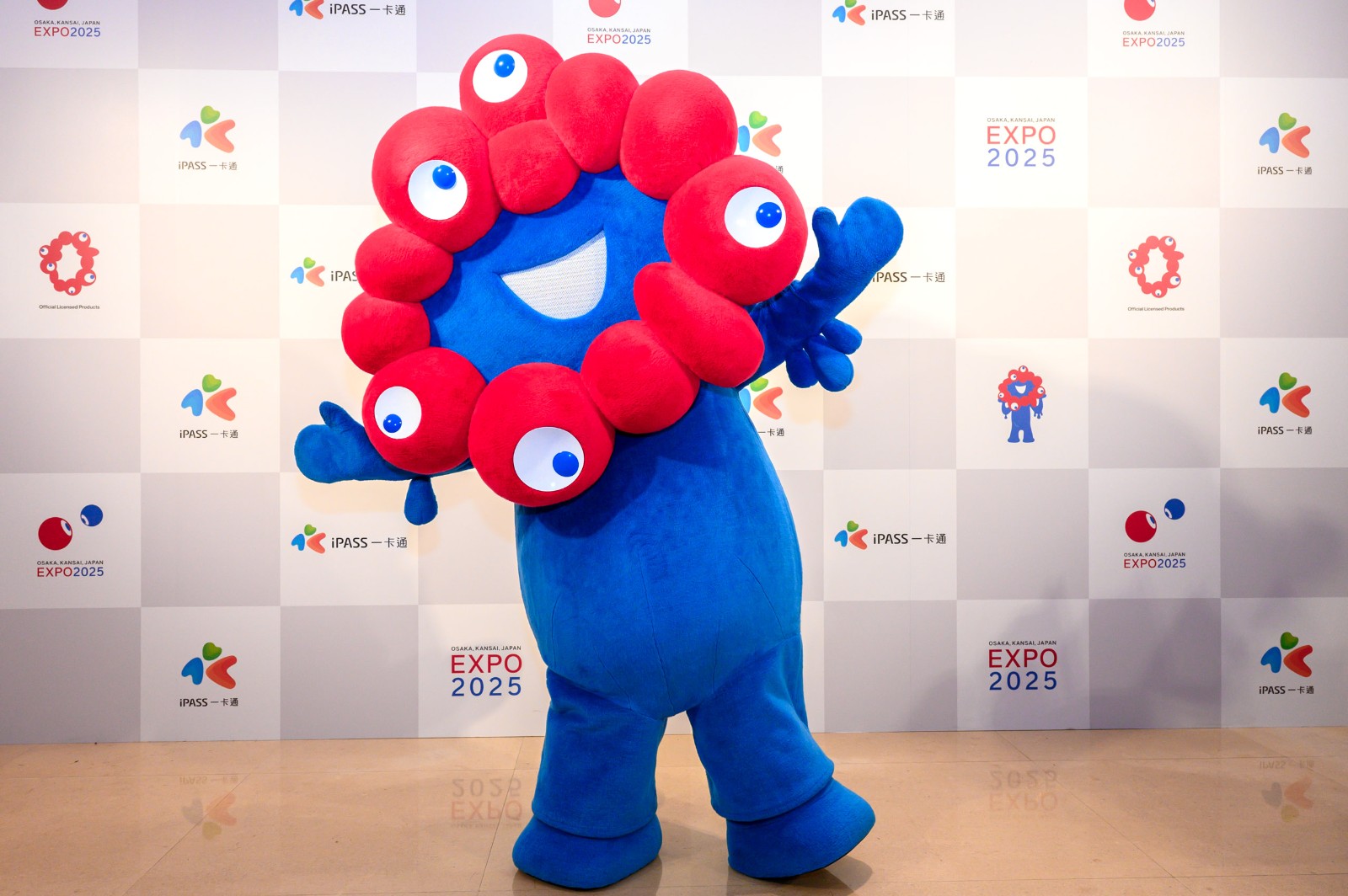 Myaku-Myaku mascot posing at the iPASS event